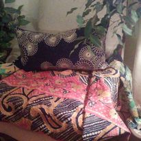 Original photograph of a chair draped with a colorful kantha textile